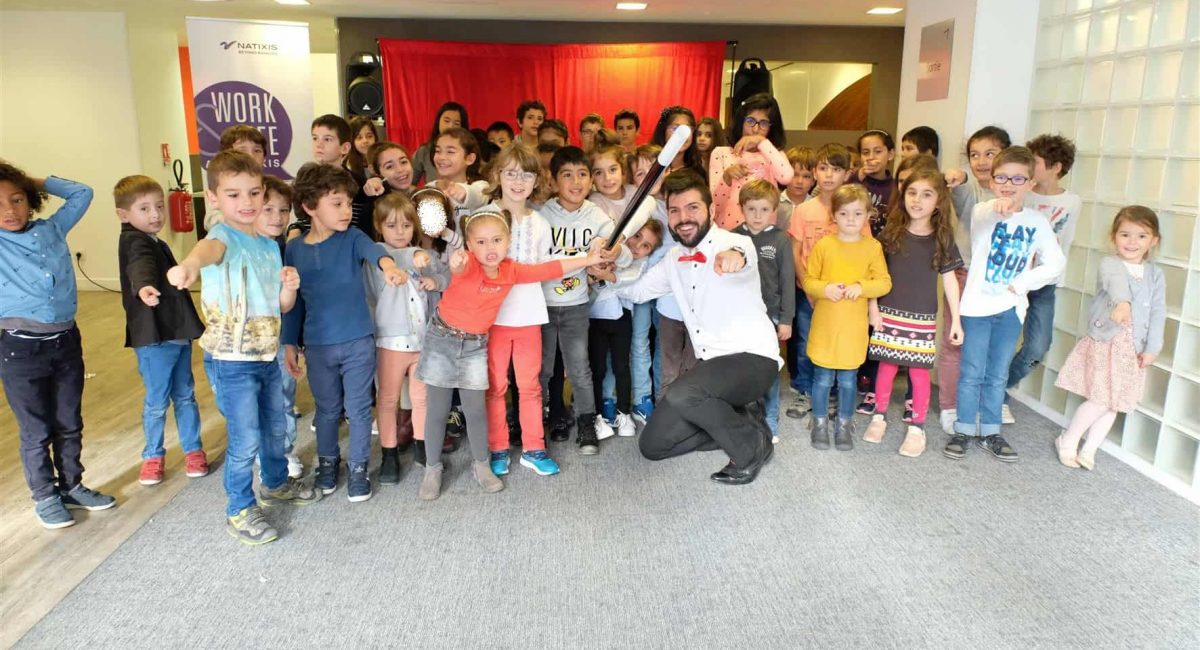 Picture of a group of kids with a magician
